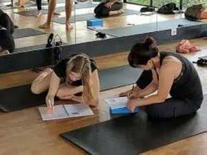 Yoga Student Taking notes